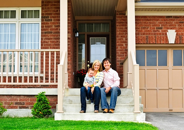 Family sitting on front porch
