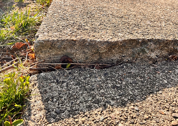 cracked unlevel sidewalk