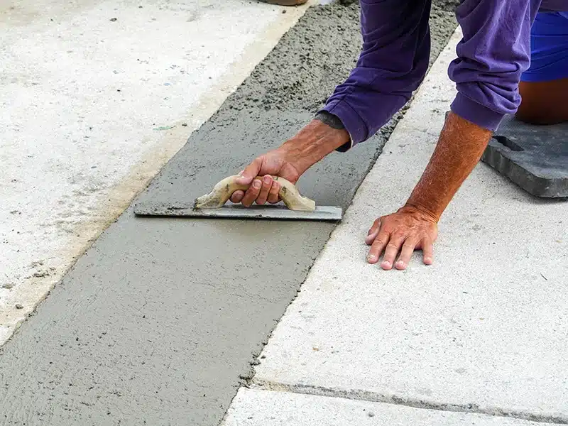 person finishing concrete