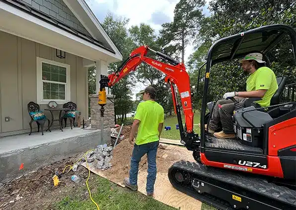 bobcat digging for foundation pier