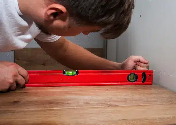 person leveling floor